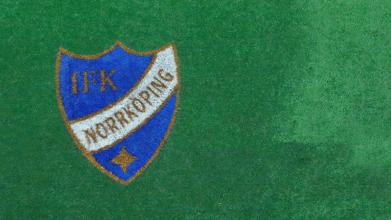 IFKs emblem på gräsplan